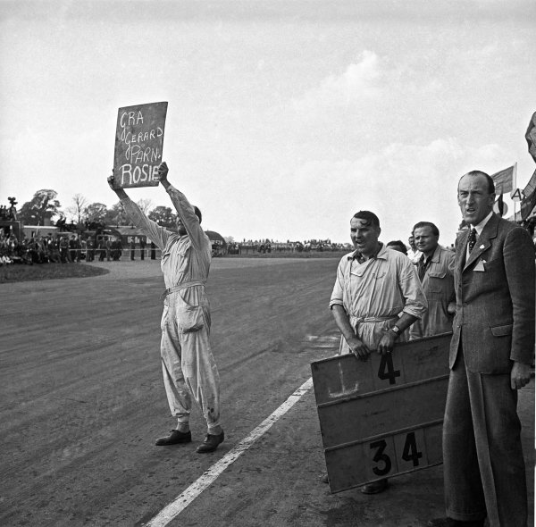 1949 British Grand Prix.
Silverstone, Great Britain. 14 May 1949.
Having retired from the race Louis Chiron, Ecurie France Lago-Talbot T26C, shows the pit board to his team mate, pitlane action.
World Copyright: LAT Photographic
Ref: Autocar glass negative