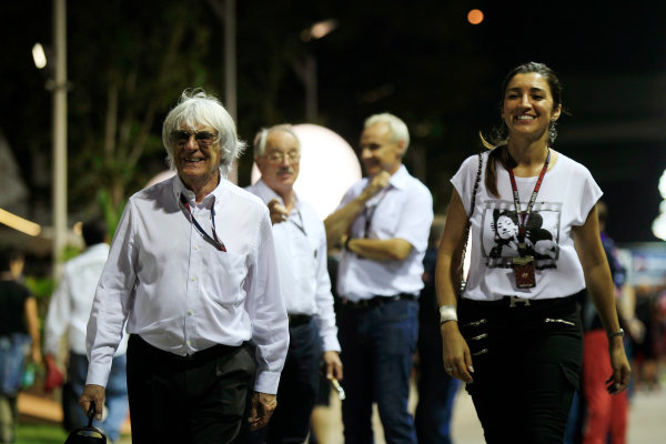 Marina Bay Circuit, Singapore.
Saturday 21st September 2013.
Bernie Ecclestone in the paddock with his wife.
World Copyright: Charles Coates/LAT Photographic.
ref: Digital Image _X5J9685 Marina Bay Circuit, Singapore.
Saturday 21st September 2013.
Bernie Ecclestone in the paddock with his wife.
World Copyright: Charles Coates/LAT Photographic.
ref: Digital Image _X5J9685