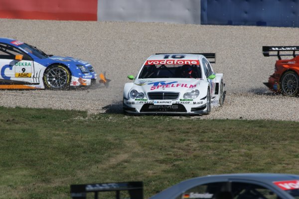 2005 DTM Championship
Lausitz, Germany. 17th - 18th September 2005
Stefan Mucke (Mucke Motorsport AMG-Mercedes C-Klasse) and Marcel Fassler (Opel Vecrta GTS V8) take a trip through the gravel.
World Copyright: Andre Irlmeier / LAT Photographic
ref: Digital Image Only