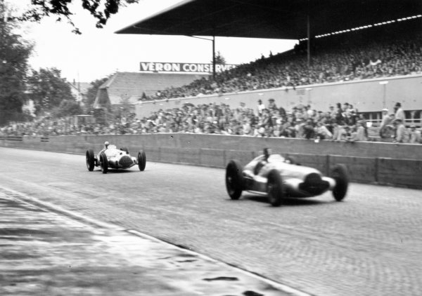 1938 Swiss Grand Prix.
Bremgarten, Berne, Switzerland. 21 August 1938.
Dick Seaman, Mercedes-Benz W154, 2nd position, leads Rudolf Caracciola, Mercedes-Benz W154, 1st position, in their duel for the lead.
Ref: RF38_SWI_62. World Copyright: Robert Fellowes/LAT Photographic
1938 Swiss Grand Prix.
Bremgarten, Berne, Switzerland. 21 August 1938.
Dick Seaman, Mercedes-Benz W154, 2nd position, leads Rudolf Caracciola, Mercedes-Benz W154, 1st position, in their duel for the lead.
Ref: RF38_SWI_62. World Copyright: Robert Fellowes/LAT Photographic