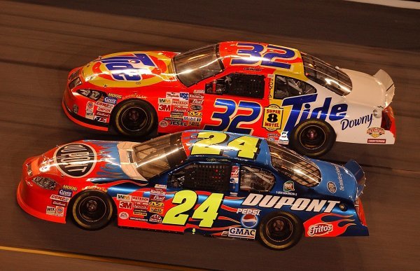 Second placed Jeff Gordon (USA) DuPont Chevrolet dives underneath Ricky Craven (USA) Tide Pontiac who finished tenth. 
Budweiser Shootout, Daytona International Speedway, Florida, USA, 8 February 2003.
DIGITAL IMAGE
