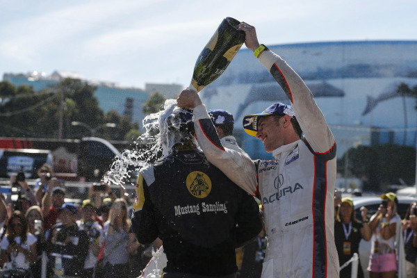 #5 Mustang Sampling Racing Cadillac DPi, DPi: Joao Barbosa, Filipe Albuquerque, #6 Acura Team Penske Acura DPi, DPi: Juan Pablo Montoya, Dane Cameron, #7 Acura Team Penske Acura DPi, DPi: Helio Castroneves, Ricky Taylor celebrate on the podium with champagne