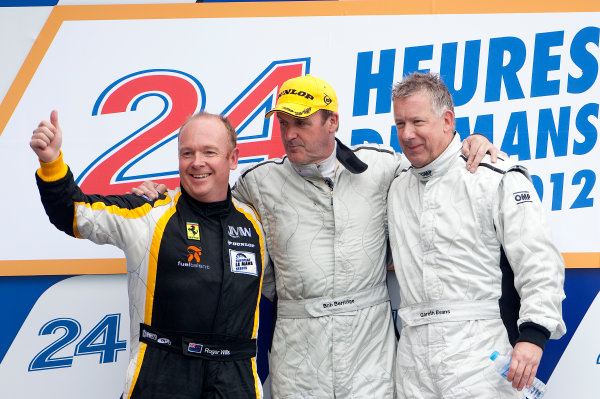 Circuit de La Sarthe, Le Mans, France. 13th - 17th June 2012. 
Group C.
Bob Berridge, No.31 Mercedes C11, 1st position, Roger Wills, No.5 Lancia LC2, 2nd position, and Gareth Evans, No.62 Sauber Mercedes C9, 3rd position, on the podium.
Photo: Daniel Kalisz/LAT Photographic.  
ref: Digital Image IMG_8288