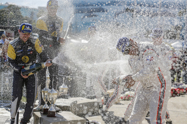 #5 Mustang Sampling Racing Cadillac DPi, DPi: Joao Barbosa, Filipe Albuquerque, #6 Acura Team Penske Acura DPi, DPi: Juan Pablo Montoya, Dane Cameron, #7 Acura Team Penske Acura DPi, DPi: Helio Castroneves, Ricky Taylor celebrate on the podium with champagne