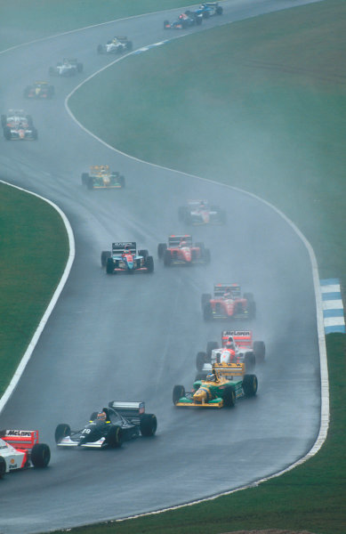 1993 European Grand Prix.
Donington Park, England.
9-11 April 1993.
Karl Wendlinger (Sauber C12 Ilmor) followed by Michael Schumacher (Benetton B193B Ford), Michael Andretti (McLaren MP4/8 Ford) and Jean Alesi (Ferrari F93A). Just behind Rubens Barrichello (Jordan 193 Hart) passes Gerhard Berger (Ferrari F93A). The rest of the field follows through Craner Curves to the Old Hairpin at the start. 
Ref-93 EUR 09.
World Copyright - LAT Photographic

