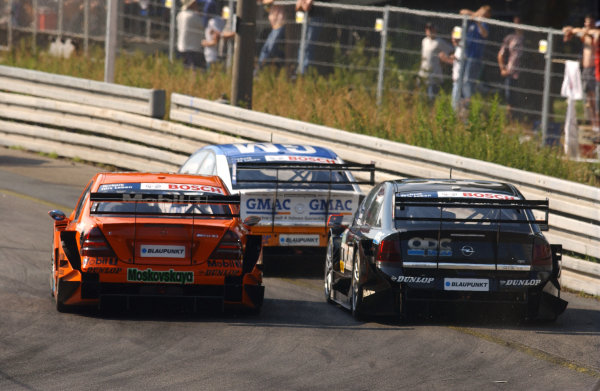 2005 DTM Championship Norisring, Germany. 16th - 17th July 2005 Marcel Fassler (Opel Vecrta GTS V8) leads Alexandros Margaritis (Mucke Motorsport AMG-Mercedes C-Klasse) and Laurent Aiello (Opel Vectra GTS V8). Action
World Copyright: Andre Irlmeier / LAT Photographic ref: Digital Image Only 2005 DTM Championship Norisring, Germany. 16th - 17th July 2005 Marcel Fassler (Opel Vecrta GTS V8) leads Alexandros Margaritis (Mucke Motorsport AMG-Mercedes C-Klasse) and Laurent Aiello (Opel Vectra GTS V8). Action
World Copyright: Andre Irlmeier / LAT Photographic ref: Digital Image Only