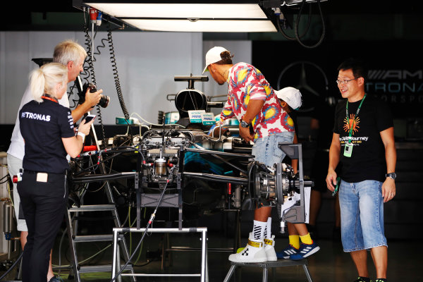 Sepang International Circuit, Sepang, Malaysia.
Thursday 28 September 2017.
Lewis Hamilton, Mercedes AMG, wears a colourful shirt whilst being photographed adjusting something in his cockpit by Steve Etherington.
World Copyright: Zak Mauger/LAT Images
ref: Digital Image _X0W6789 Sepang International Circuit, Sepang, Malaysia.
Thursday 28 September 2017.
Lewis Hamilton, Mercedes AMG, wears a colourful shirt whilst being photographed adjusting something in his cockpit by Steve Etherington.
World Copyright: Zak Mauger/LAT Images
ref: Digital Image _X0W6789