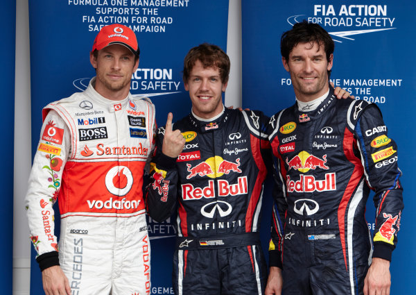 Interlagos, Sao Paulo, Brazil.
26th November 2011.
Top three qualifiers Sebastian Vettel, Red Bull Racing RB7 Renault, Mark Webber, Red Bull Racing RB7 Renault, and Jenson Button, McLaren MP4-26 Mercedes. Portrait. 
World Copyright: Steve Etherington/LAT Photographic
ref: Digital Image SNE27545