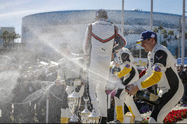 #4 Corvette Racing Corvette C7.R, GTLM: Oliver Gavin, Tommy Milner, #912 Porsche GT Team Porsche 911 RSR, GTLM: Earl Bamber, Laurens Vanthoor, #3 Corvette Racing Corvette C7.R, GTLM: Jan Magnussen, Antonio Garcia celebrate on the podium with champagne