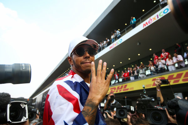Autodromo Hermanos Rodriguez, Mexico City, Mexico.
Sunday 29 October 2017.
Lewis Hamilton, Mercedes AMG, with Union flag across his shoulders, holds four fingers up in celebration of becoming the first British 4 times world champion in history.
World Copyright: Charles Coates/LAT Images
ref: Digital Image DJ5R7878 Autodromo Hermanos Rodriguez, Mexico City, Mexico.
Sunday 29 October 2017.
Lewis Hamilton, Mercedes AMG, with Union flag across his shoulders, holds four fingers up in celebration of becoming the first British 4 times world champion in history.
World Copyright: Charles Coates/LAT Images
ref: Digital Image DJ5R7878