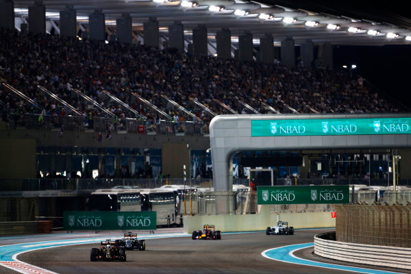Yas Marina Circuit, Abu Dhabi, United Arab Emirates.
Sunday 29 November 2015.
Romain Grosjean, Lotus E23 Mercedes, leads Nico Hulkenberg, Force India VJM08 Mercedes, and Daniil Kvyat, Red Bull Racing RB11 Renault.
World Copyright: Sam Bloxham/LAT Photographic
ref: Digital Image _SBL9192 Yas Marina Circuit, Abu Dhabi, United Arab Emirates.
Sunday 29 November 2015.
Romain Grosjean, Lotus E23 Mercedes, leads Nico Hulkenberg, Force India VJM08 Mercedes, and Daniil Kvyat, Red Bull Racing RB11 Renault.
World Copyright: Sam Bloxham/LAT Photographic
ref: Digital Image _SBL9192
