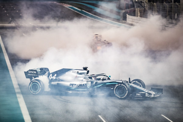 Max Verstappen, Red Bull Racing RB15, 2nd position, and Lewis Hamilton, Mercedes AMG F1 W10, 1st position, perform donuts in celebration at the end of the race Max Verstappen, Red Bull Racing RB15, 2nd position, and Lewis Hamilton, Mercedes AMG F1 W10, 1st position, perform donuts in celebration at the end of the race