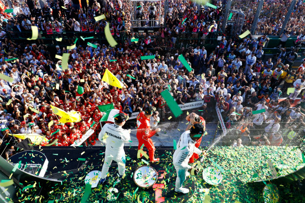 Albert Park, Melbourne, Australia.
Sunday 26 March 2017.
A burst of ticker tape covers the podium. Race winner Sebastian Vettel, Ferrari, 1st Position, celebrates with Luigi Fraboni, Head of Power Unit Race Operation, Ferrari. The pair are joined by Lewis Hamilton, Mercedes AMG, 2nd Position, and Valtteri Bottas, Mercedes AMG, 3rd Position.
World Copyright: Steven Tee/LAT Images
Ref: Digital Image _O3I3304