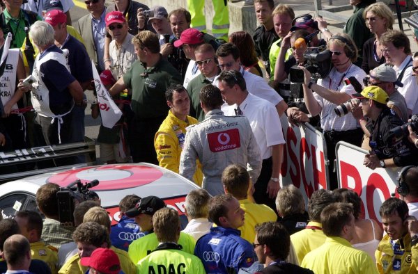 2002 DTM Championship 
Norisring, Germany. 29th - 30th June 2002. 
Bernd Scnedier (HWA Mercedes) was far from impressed with the manner in which race winner Laurent Aiello (Abt Audi TT-R) overtook him into the last corner.
World Copyright: Andre Irlmeier/LAT Photographic

