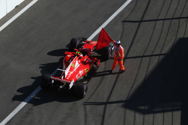 Sochi Autodrom, Sochi, Russia.
Friday 28 April 2017.
A marshal tries, unsuccessfully, to stop Kimi Raikkonen, Ferrari SF70H, from leaving the pit lane at the end of the session.
World Copyright: Coates/LAT Images
ref: Digital Image AN7T1180