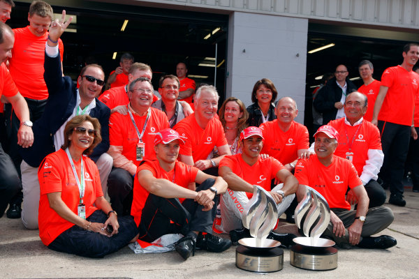 Silverstone, Northamptonshire, UK.
6th July 2008.
Lewis Hamilton, McLaren MP4-23 Mercedes, 1st position, and Heikki Kovalainen, McLaren MP4-23 Mercedes, 5th position, with the McLaren team after the race. Portrait. 
World Copyright: Glenn Dunbar/LAT Photographic.
ref: Digital Image _O9T7452