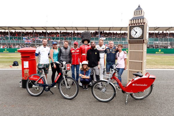 Silverstone, Northamptonshire, UK. 
Thursday 13 July 2017.
Stoffel Vandoorne, McLaren,Marc Gene of Ferrari and Jenson Button, McLaren, pose with guests and Sky presenter Natalie Pinkham.
World Copyright: Glenn Dunbar/LAT Images 
ref: Digital Image _X4I2736