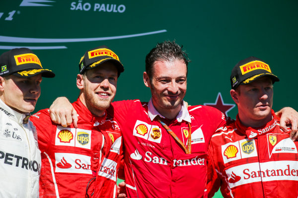 Interlagos, Sao Paulo, Brazil.
Sunday 12 November 2017.
Valtteri Bottas, Mercedes AMG, 2nd Position, Sebastian Vettel, Ferrari, 1st Position, Giuseppe Vietina, Race Operations Manager, Ferrari, and Kimi Raikkonen, Ferrari, 3rd Position, on the podium.
World Copyright: Charles Coates/LAT Images 
ref: Digital Image AN7T7224