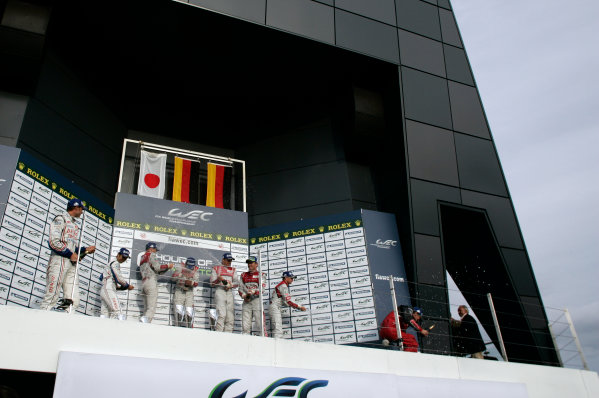 Silverstone, England. 24th - 26th August 2012. Rd 4.
Alexander Wurz (AUT), Nicolas Lapierre (FRA), Kazuki Nakajima (JPN), Toyota Racing, Toyota TS030 Hybrid, Andre Lotterer (GER), Marcel Fassler (CHE), Benoit Treluyer (FRA), Audi Sport Team Joest, Audi R18 E-Tron Quatrro, Tom Kristensen (DNK), Allan McNish (GBR), Audi Sport Team Joest, Audi R18 Ultra, celebrate, Podium, Portrait, 
World Copyright: Chris Bird/LAT Photographic.
Ref:  _A1A0884