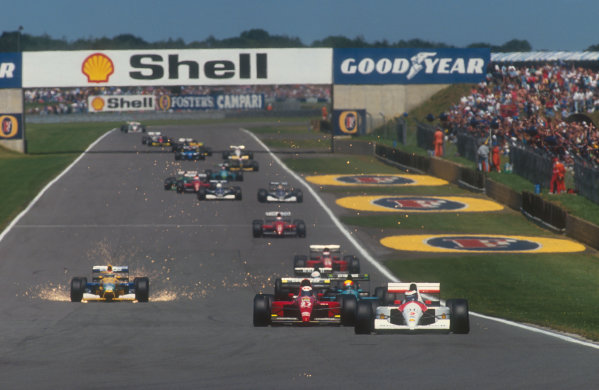 1991 British Grand Prix.
Silverstone, England.
12-14 July 1991.
Gerhard Berger (McLaren MP4/6 Honda) on the approach to Stowe at the start, with Alain Prost (Ferrari 643), Mauricio Gugelmin (Leyton House CG911 Ilmor), Stefano Modena (Tyrrell 020 Honda) and a super sparking Nelson Piquet (Benetton B191 Ford) following behind down Hangar Straight.
Ref-91 GB 10.
World Copyright - LAT Photographic
1991 British Grand Prix.
Silverstone, England.
12-14 July 1991.
Gerhard Berger (McLaren MP4/6 Honda) on the approach to Stowe at the start, with Alain Prost (Ferrari 643), Mauricio Gugelmin (Leyton House CG911 Ilmor), Stefano Modena (Tyrrell 020 Honda) and a super sparking Nelson Piquet (Benetton B191 Ford) following behind down Hangar Straight.
Ref-91 GB 10.
World Copyright - LAT Photographic