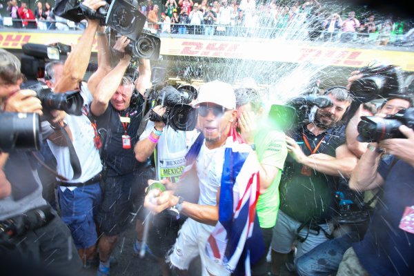 Autodromo Hermanos Rodriguez, Mexico City, Mexico.
Sunday 29 October 2017.
Lewis Hamilton, Mercedes AMG, sprays Champagne at photographers in celebration of securing his 4th world drivers championship title.
World Copyright: Charles Coates/LAT Images
ref: Digital Image DJ5R7718 Autodromo Hermanos Rodriguez, Mexico City, Mexico.
Sunday 29 October 2017.
Lewis Hamilton, Mercedes AMG, sprays Champagne at photographers in celebration of securing his 4th world drivers championship title.
World Copyright: Charles Coates/LAT Images
ref: Digital Image DJ5R7718