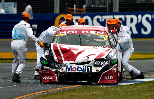 2004 Australian V8 Supercars.
Non-Championship Round. Albert Park, Melbourne, 5th - 7th March.
Mark Skaife's car is cleared form the track after a first corner crash with Simon Wills in race 3. 
World Copyright: Mark Horsburgh/LAT Photographic
ref: Digital Image Only

