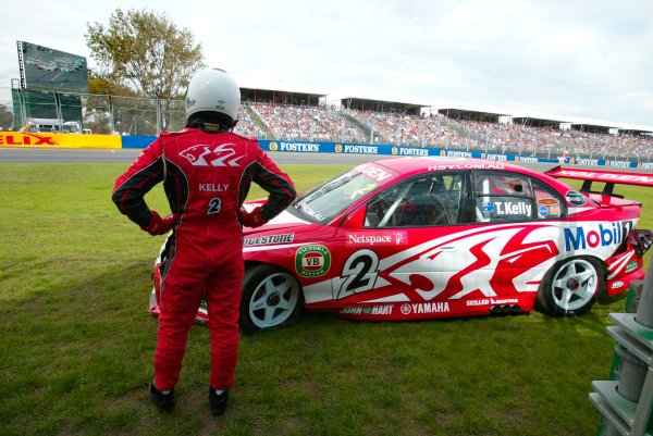 2003 Australian V8 Supercars Melbourne
Victoria,Australia 9th March 2003
New HRT driver Todd Kelly watches a replay of the crash which put him out of race 1 of the V8 Supercars at the 2003 Australian GP.
World Copyright: Mark Horsburgh/LAT
Photographic ref: Digital Image Only

