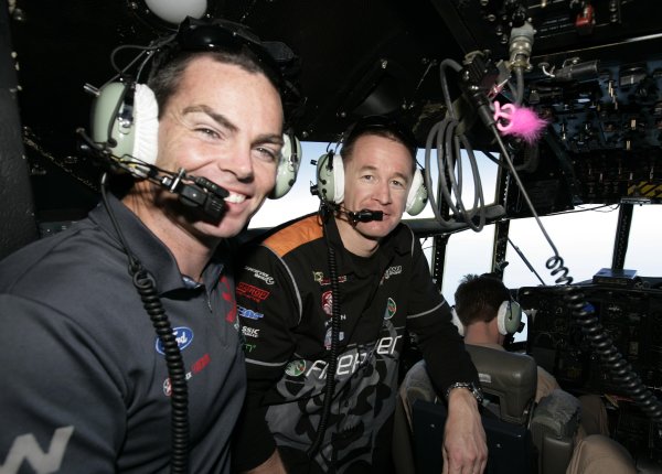 2007 Australian V8 Supercars.
Bahrain International Circuit. Sakhir, Bahrain.
2nd - 4th November. 
Craig Lowndes and Greg Murphy on the flight deck of an Australian C130 as they fly into visit the Australian troops based at Tallil Airbase located approximately 310 kilometers Southeast of Baghdad, Iraq.
World Copyright: Mark Horsburgh/LAT Photographic. 
Ref: Digital Image V8-Drivers-IRAQ-7100