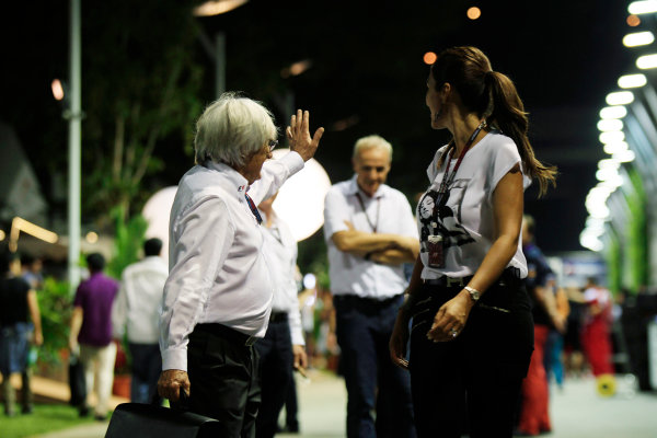 Marina Bay Circuit, Singapore.
Saturday 21st September 2013.
Bernie Ecclestone in the paddock with his wife.
World Copyright: Charles Coates/LAT Photographic.
ref: Digital Image _X5J9691