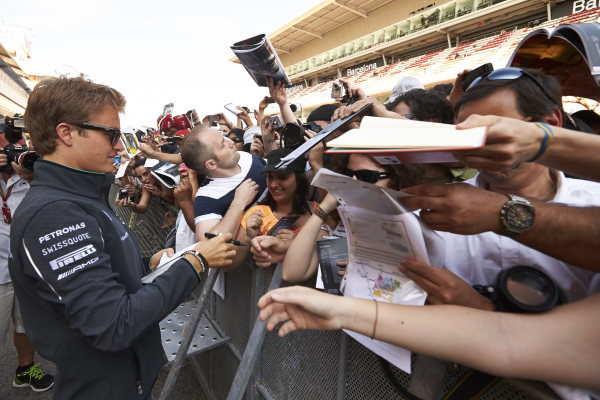 Circuit de Catalunya, Barcelona, Spain.
Thursday 8 May 2014.
Nico Rosberg, Mercedes AMG, signs autographs for fans.
World Copyright: Steve EtheringtonLAT Photographic.
ref: Digital Image SNE11637 copy